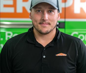 Profile picture of male in front of a SERVPRO truck with a hat 